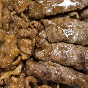 49. Grilled Beef Wrapped Onion, Charbroiled Pork, and Spring Rolls (2 pcs)