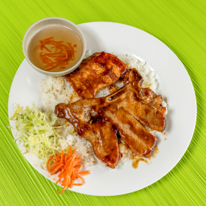 63. Grilled Pork Chop, Lemongrass Chicken on Steamed Rice