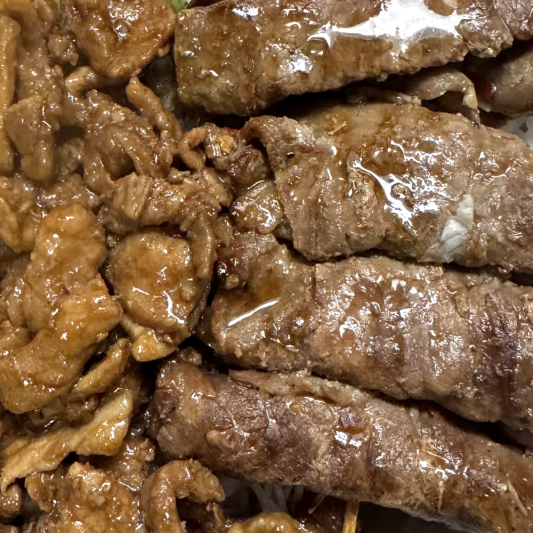 49. Grilled Beef Wrapped Onion, Charbroiled Pork, and Spring Rolls (2 pcs)