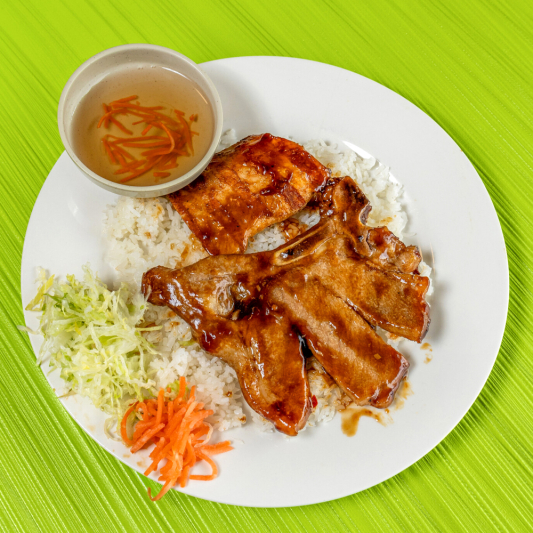 63. Grilled Pork Chop, Lemongrass Chicken on Steamed Rice