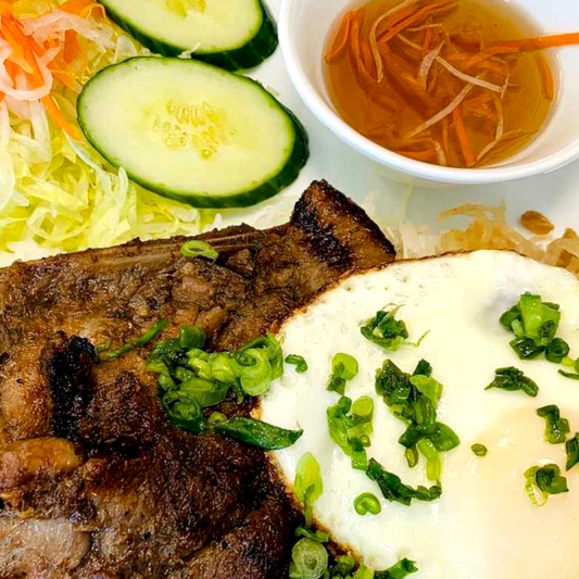 31. Grilled Pork Chop, Shredded Pork Skin, & Fried Egg on Rice / Com Suon Bi Trung