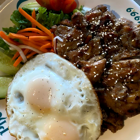 68. Rice with Two Eggs Sunny-Side Up and Lemongrass Pork Chop