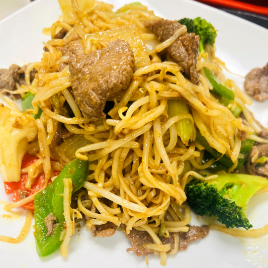 54. Stir-Fried Beef with Vegetables on Soft Egg Noodles
