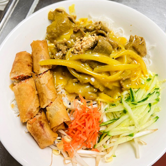 20B. Stir-Fried Curry Beef & Spring Rolls on Rice Vermicelli