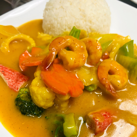 47. Stir-Fried Curry Seafood with Vegetables on Steamed Rice