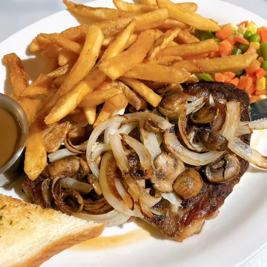 38. Rib Steak with Mushrooms & Onion