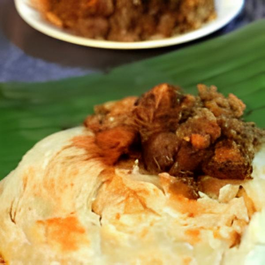 Butter Chicken Kizhi Parotta