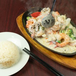 82. Sizzling Lemongrass Coconut Prawns